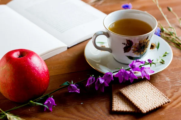 Still life in a rustic style with vintage book, wild flowers — Stock Photo, Image