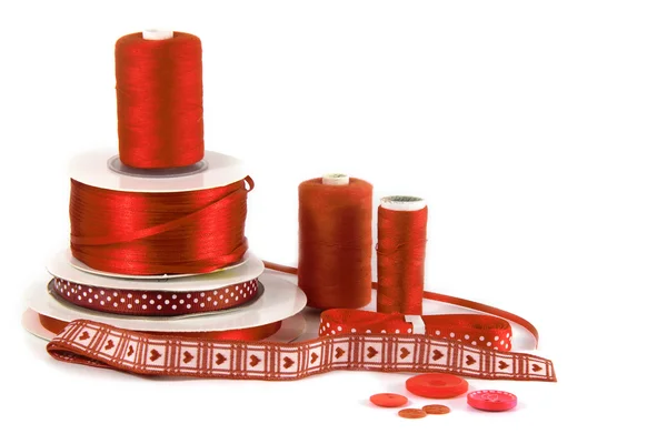 Red haberdashery craft items on white background — Stock Photo, Image