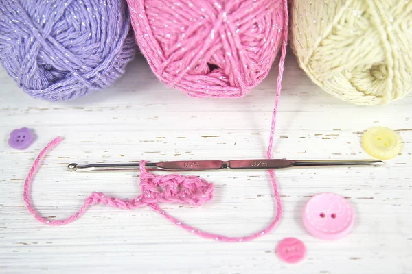 Pretty Crochet scene with yarn wool and buttons — Stock Photo, Image