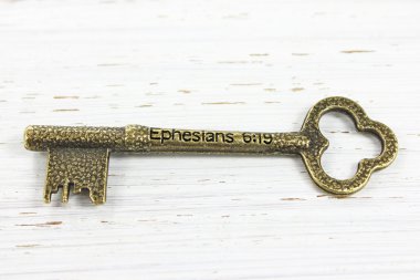 Ephesians 6 verse 19 engraved on an antique brass key clipart