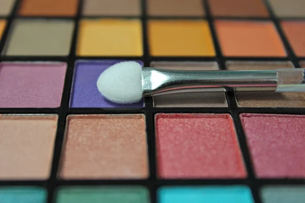 Eyeshadow make up palette with focus on applicator Stock Picture