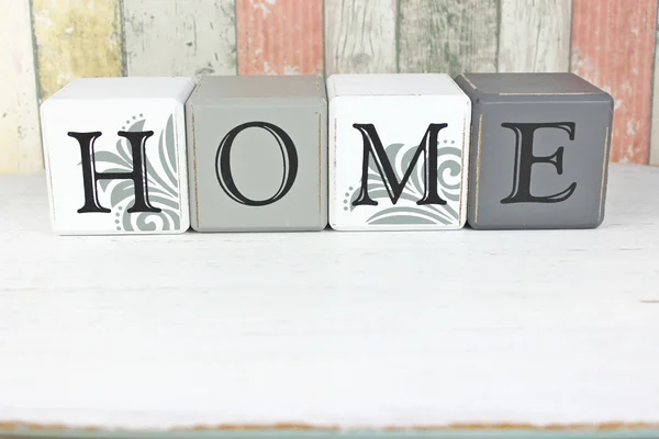 Home sign on a distressed wood background Stock Photo