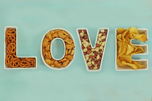 Love snacks in Love letter bowls Royalty Free Stock Images