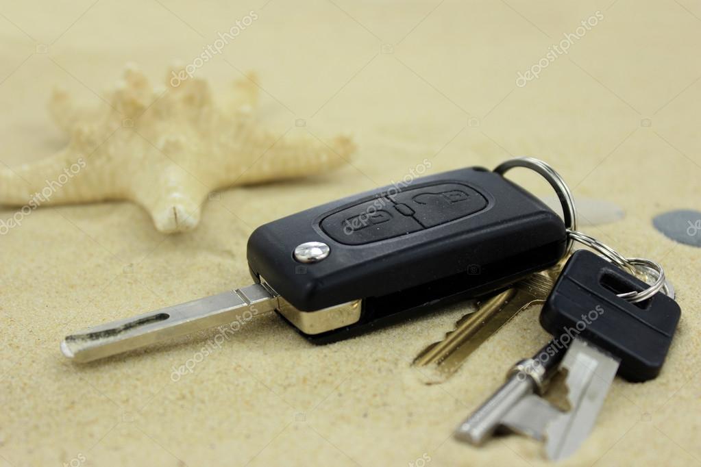 Car and house keys lost on the sand Stock Photo by ©fieldwork 63208223