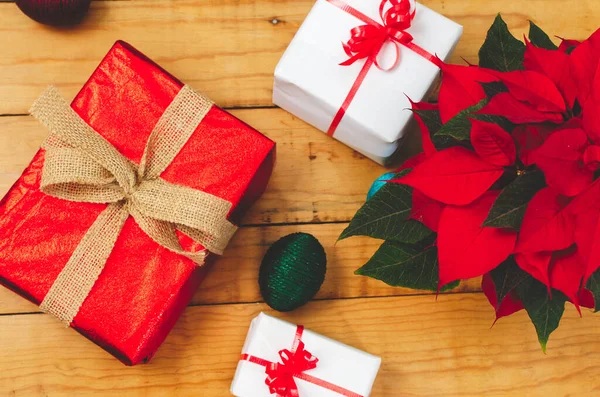 Wooden Table Christmas Gifts Poinsettia Plant — Stock Photo, Image