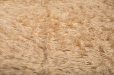 Yumuşak, kabarık bej kumaşlı, kabarık desenli. Arkaplan, doku.