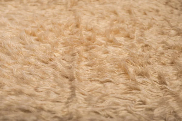 Yumuşak, kabarık bej kumaşlı, kabarık desenli. Arkaplan, doku.