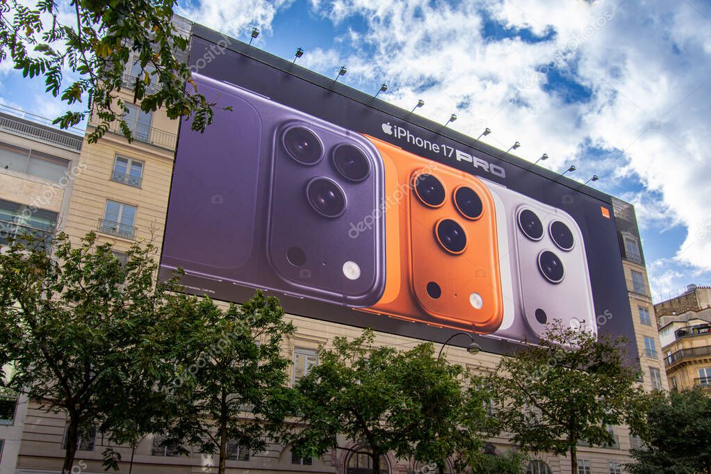 Paris, France - October 24, 2025: Large advertising billboard for the Apple iPhone 17 Pro smartphone covering the scaffolding of restoration work on the facade of a Parisian building