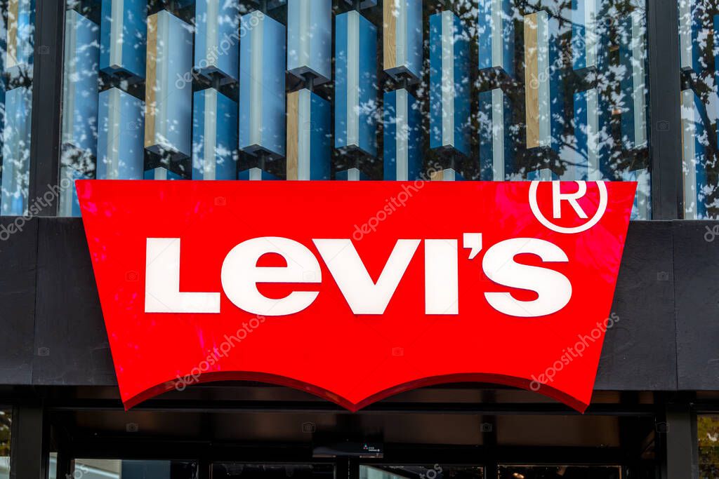 Paris, France - November 3, 2025: Sign and logo of a Levi's boutique. Levi Strauss and Co. is an American brand and chain of fashion stores world famous for its denim blue jeans