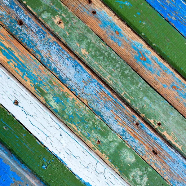 Texturou pozadí staré dřevěné stodole prken různých barev. čtvercové fotografie s kopií prostor pro text — Stock fotografie