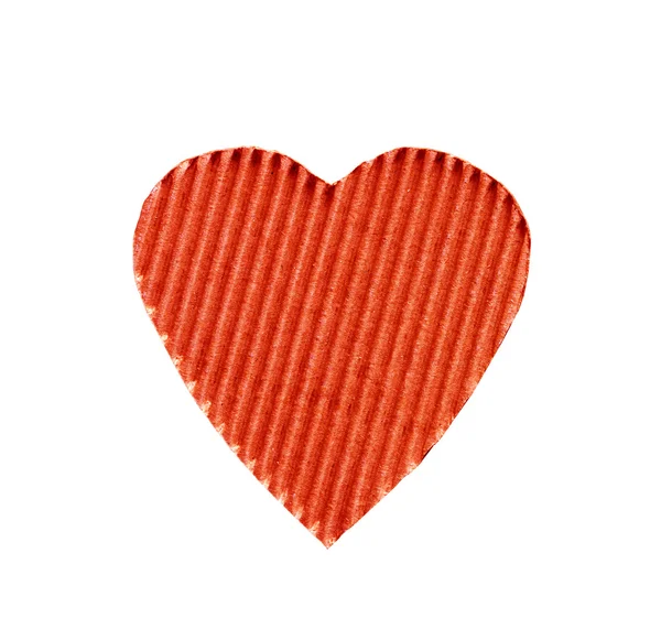 Le symbole d'un cœur coupé à partir de carton ondulé de couleur rouge isolé sur fond blanc. le concept d'amour, Saint Valentin — Photo