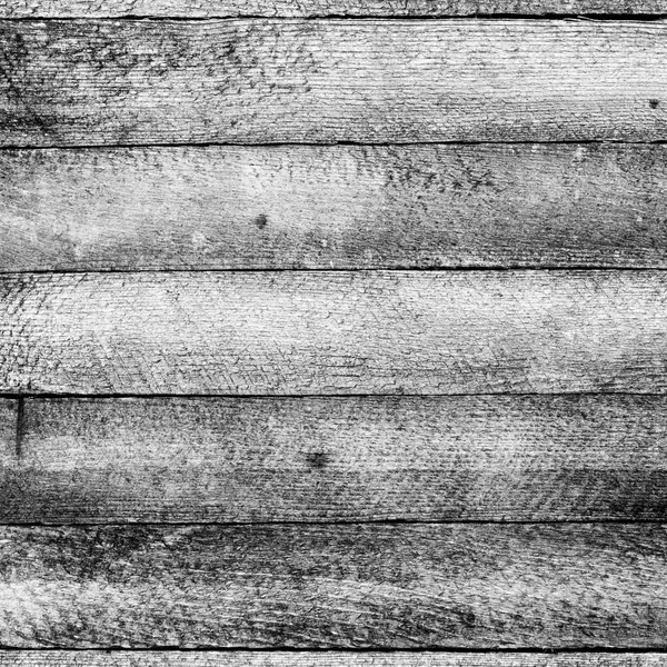 Texturou staré dřevěné grunge pozadí s horizontální stodola desek. černá a bílá tónovaný fotografie — Stock fotografie