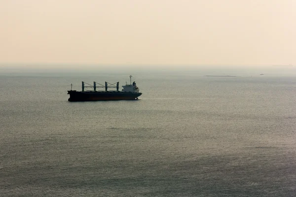 Cargo ship at sea in calm, selective focus — Stock Photo, Image