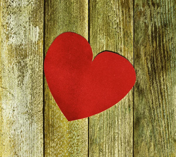 Big red heart velvet paper on old wooden boards close up. The concept of love, Valentine's day. tinted photo — Stock Photo, Image