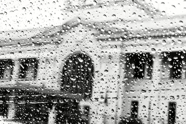 View of the street through the window of the car in rainy weather in black and white — Stock Photo, Image