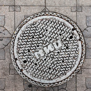 Close-up of the metal manhole cover in thailand clipart