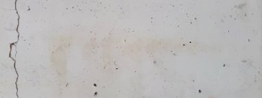 Kusursuz çatlamış beton duvar dokusu. Sıkıntılı grunge taş yüzeyinin, hasar ve çizik efektli, sert çimento arka planı, klasik iç döşeme, alçı tahribatı gibi gerçekçi bir temsili.
