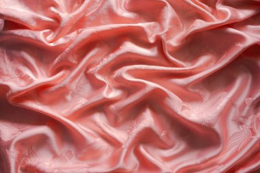 Luxuriors saten kumaş veya ipek soyut arka plan. Renkli turuncu karışıklığın dokusu ve deseni saten kumaş, metin için en üstten görünüm.