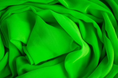Arkaplan için yeşil kumaş veya lüks ipek saten.
