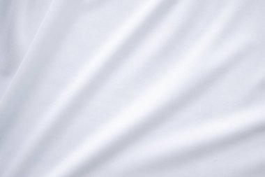 Beyaz kumaş pamuk arka plan. Soyut doku, lüks kumaş yumuşak dalga görüntüsü. boş alan arkaplanındaki ürünleri iyi kullanmak ya da tanıtmak için metin kullanabilirsiniz. Üst görünüm veya düz uzanma.
