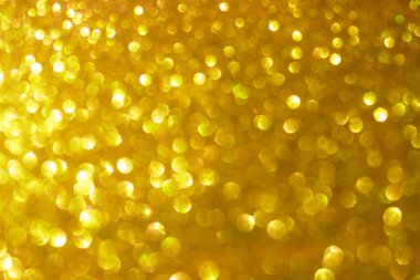 Altın bokeh arka plan mutlu yıl 2022 sarı soyut parlaklık efekti odak çemberi duvar kağıdından ışık gecesi. Noel partisi bayramları ya da teknoloji geçmişi için..