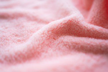 Pembe havlu arka planı. Yumuşak bir kumaş dalgası. Yeni modern tasarım lüks ışık ve yumuşak dalga pürüzsüz ipek duvar kağıdı. Boş yer. Kart posteri veya sunum ürünleri kavramı için.
