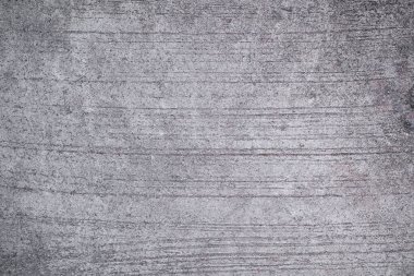 Eski gri çimento kaba ve çatlak yapısı. Eski duvar desenli, karanlık desenli, kirli beton arka plan. Boş alanı olan düz bir yer. tasarım materyali kavramı.