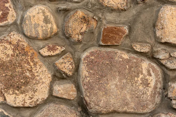 Kamienny mur brukowy, ściana z bliska, kamienne tło, brukowy wzór — Zdjęcie stockowe