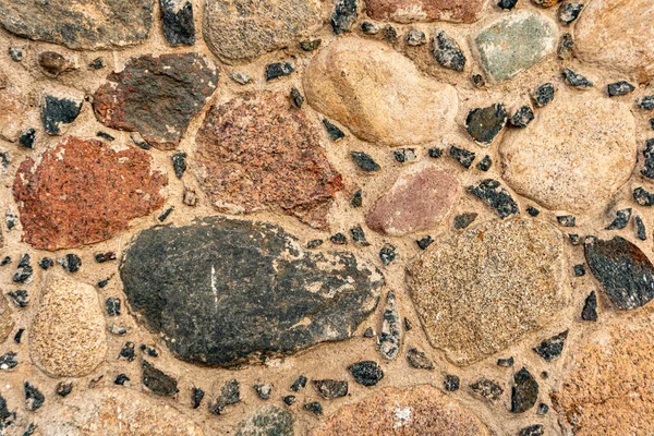 Zbliżenie kamienna ściana, bruk murarski, kamienne tło, bruk wzór — Zdjęcie stockowe