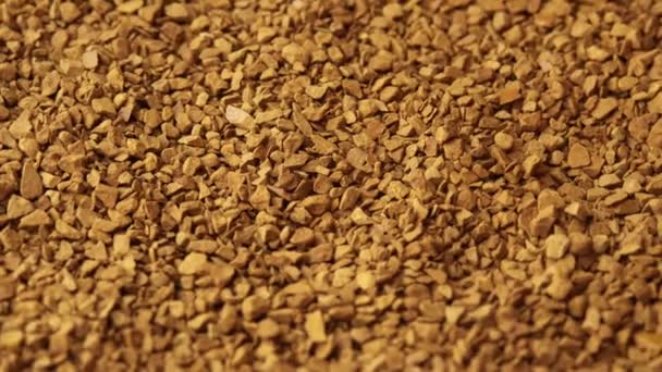 Close-up of instant coffee pellets spinning as background for coffee shop, granulated coffee commercial, morning cheerfulness — Stock Video
