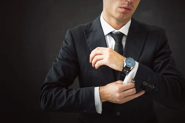 Business man fixing his shirt — Stock Photo, Image