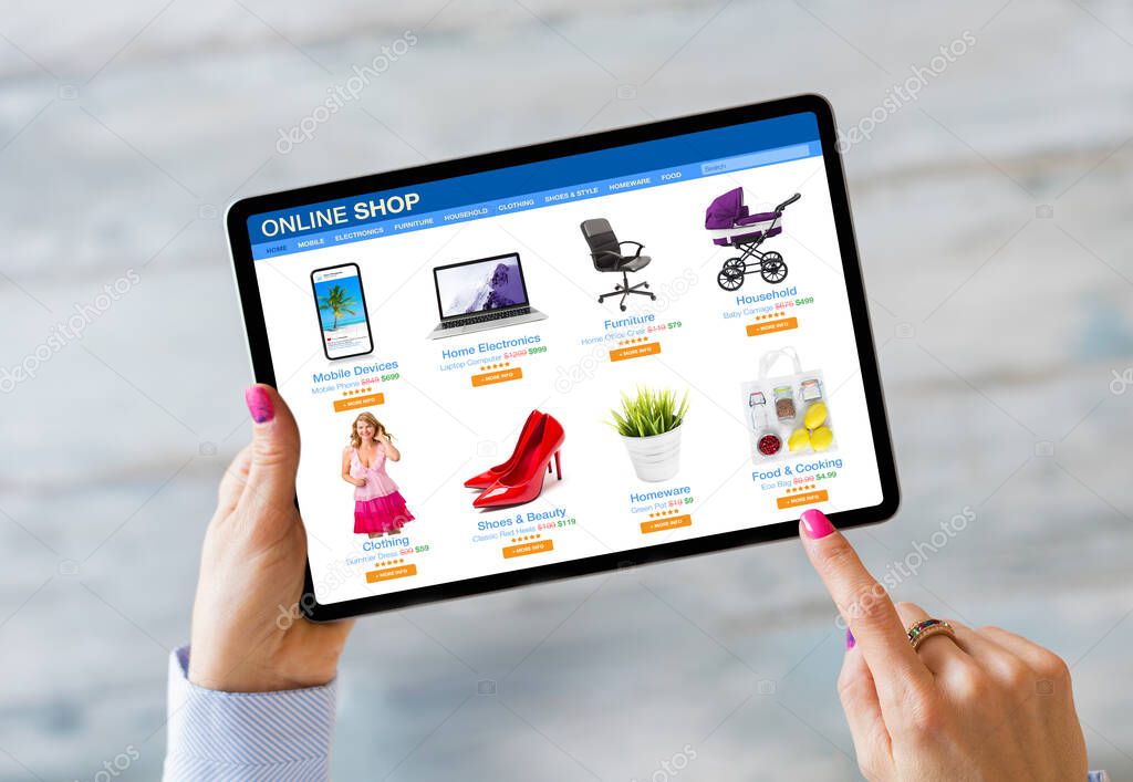 Woman shopping on online store by using tablet computer