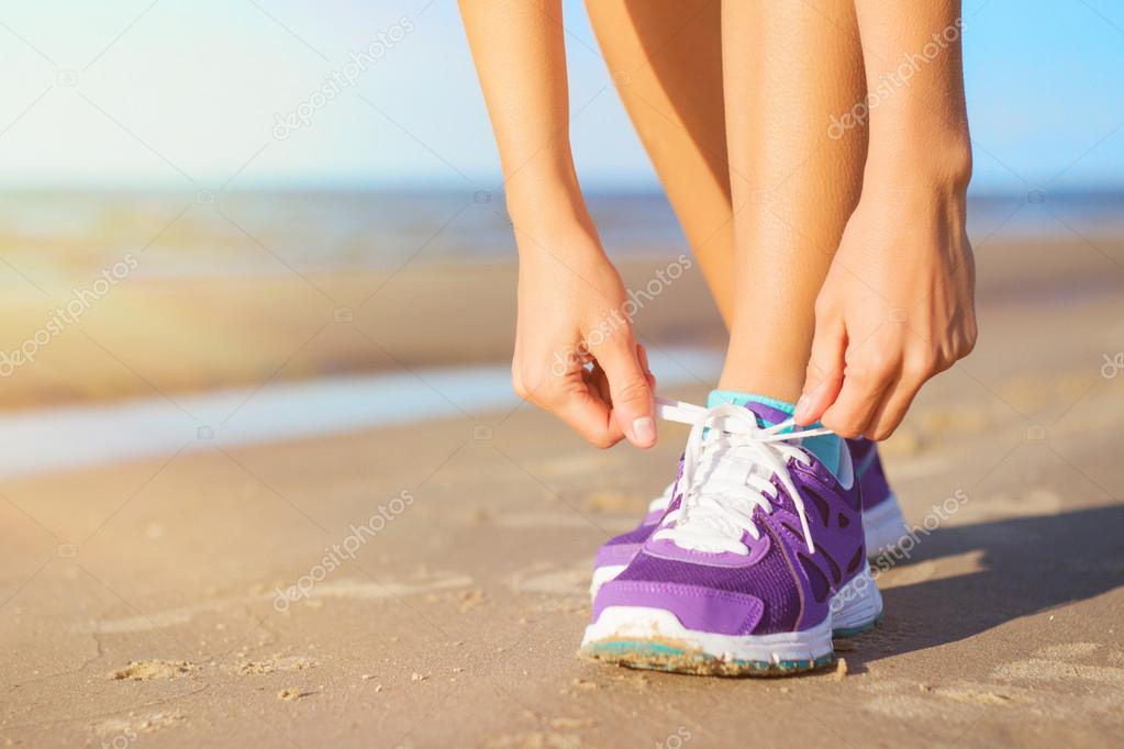Woman wearing running shoes — Stock Photo © grinvalds 54829169