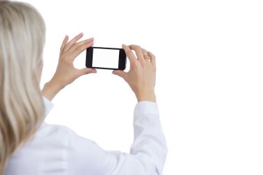 Kadın alarak fotoğraf ile hareket eden telefon. Kendi görüntü için izole beyaz arka plan.