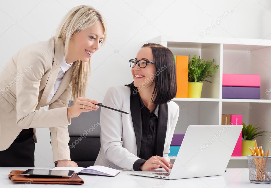 Two female colleagues working together