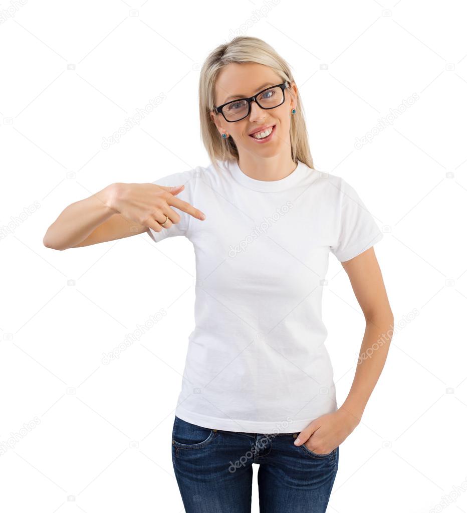 Woman wearing blank white t-shirt and pointing to it