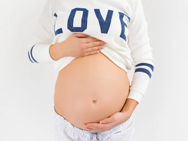 Barriga de mulher grávida — Fotografia de Stock