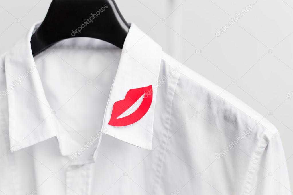 Red lip symbol on white men's shirt