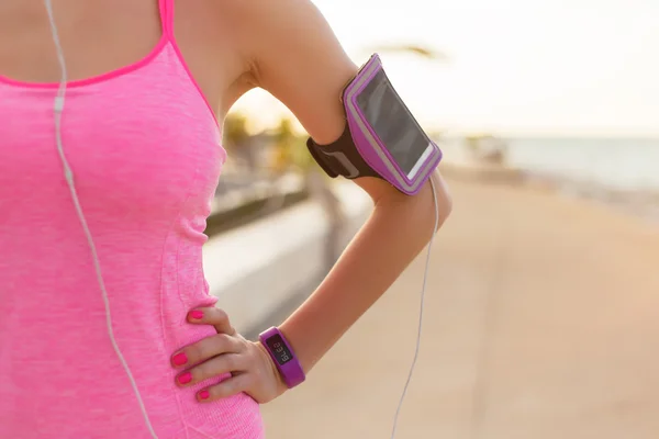 Close-up photo of smartphone holder on woman's arm — Stock Photo, Image