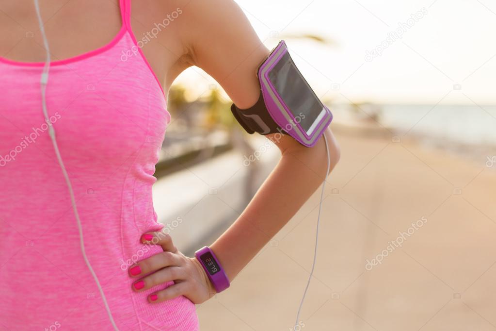 Close-up photo of smartphone holder on woman's arm