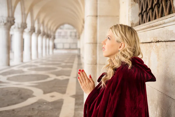 Mysterious woman in red cloak — Stock Photo, Image