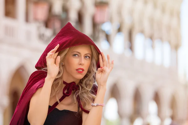 Mysterious woman in red cloak — Stock Photo, Image