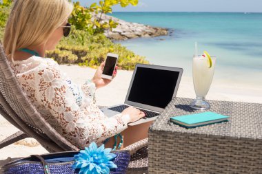 Woman working on the beach clipart
