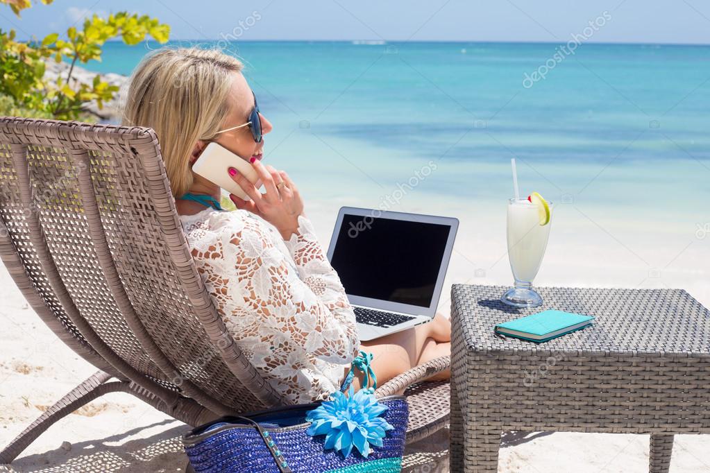 Woman working on the beach