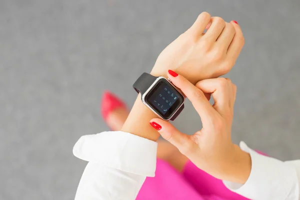 Woman with digital watch