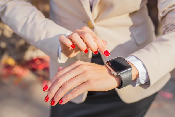 Woman with digital watch — Stock Photo, Image