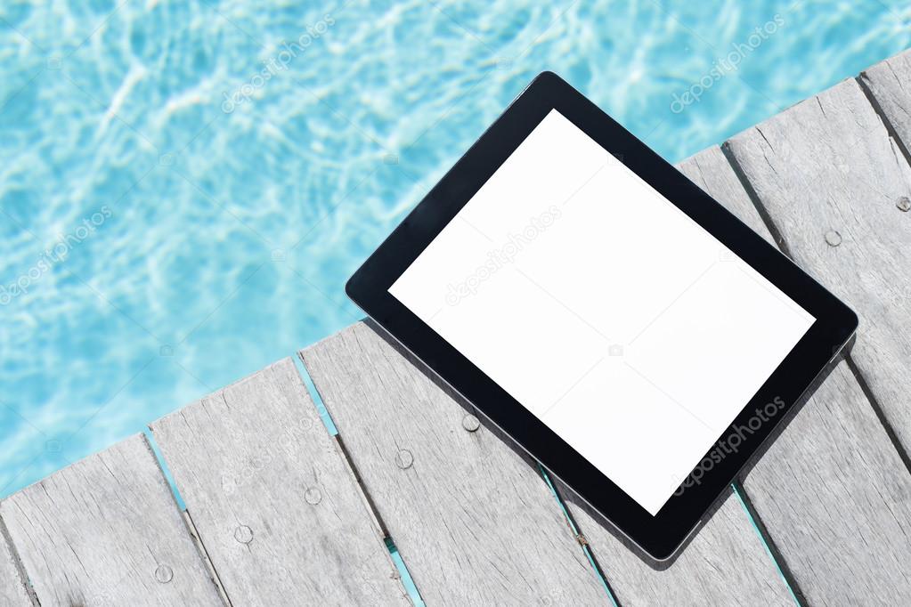 One tablet by the pool