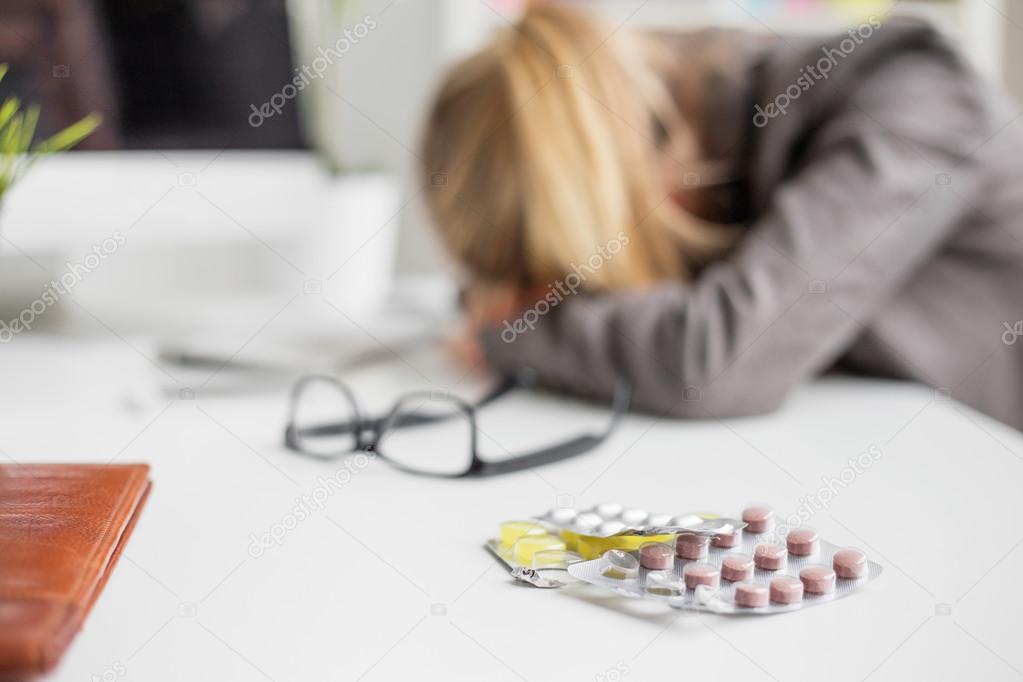 Woman sleeping on desk