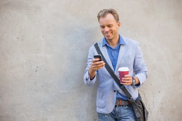 Man with coffee outdoors — Stock Photo, Image