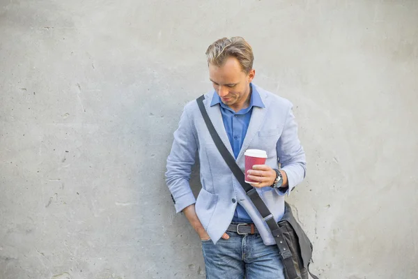 Man with coffee outdoors — Stock Photo, Image